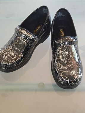 Savvy Black Slip-On Shoes with Gold Logo